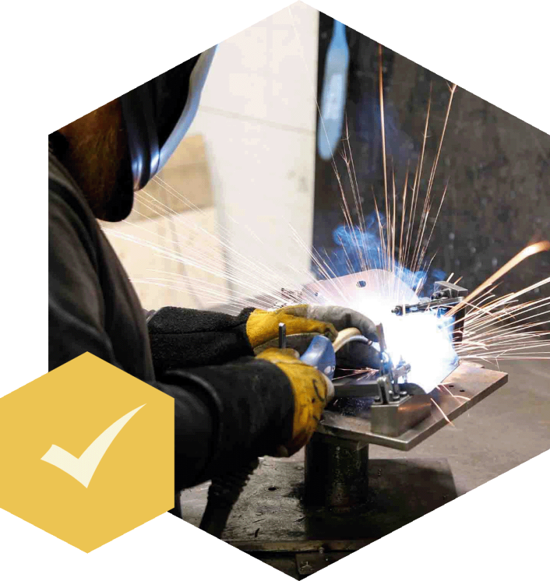 Hexagon om oss person svetsar